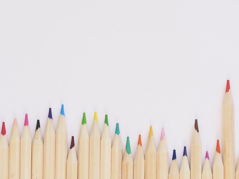 Child drawing on a colorful magnetic doodle board